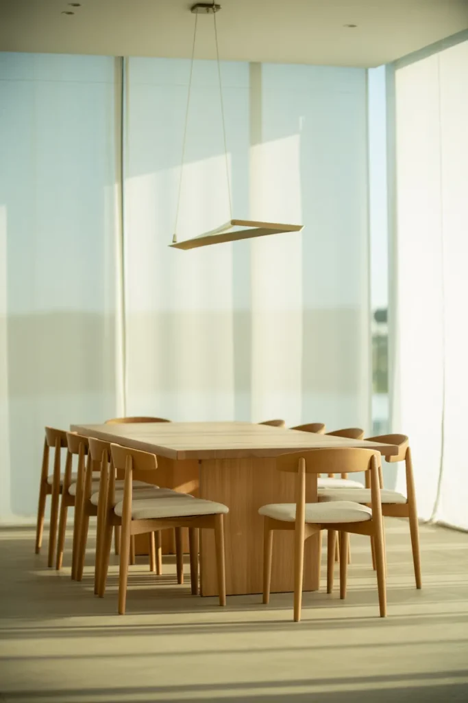Minimalist White Dining Room with Natural Wood Table